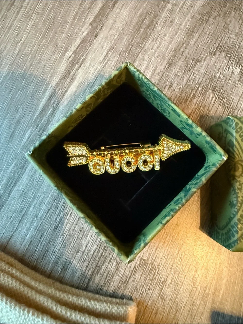 Gold Brooch and GG Designed Socks